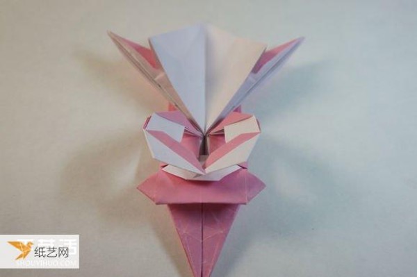 Illustrated step-by-step tutorial for girls using origami to fold something that looks complicated