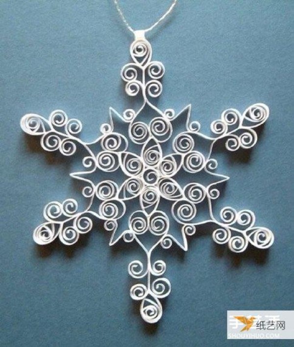 Illustration of how to make beautiful rolled paper snowflakes by hand using quilling paper