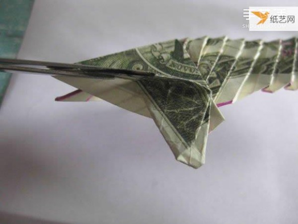 How to fold paper carp using dollars