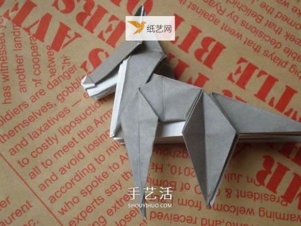 Illustration of hand folding cute puppy using origami