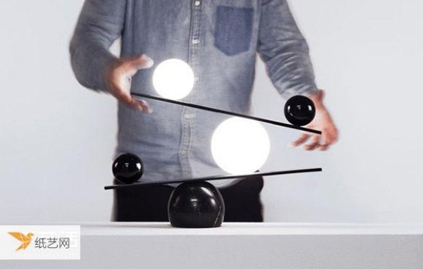 A clever balance between black and white. Balance table lamp designed by the Light Magician