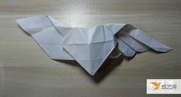 Illustration of the steps of origami with wings and flying heart