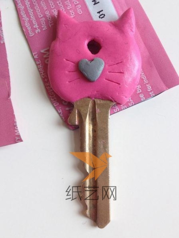 Kitten shaped key decoration made from clay