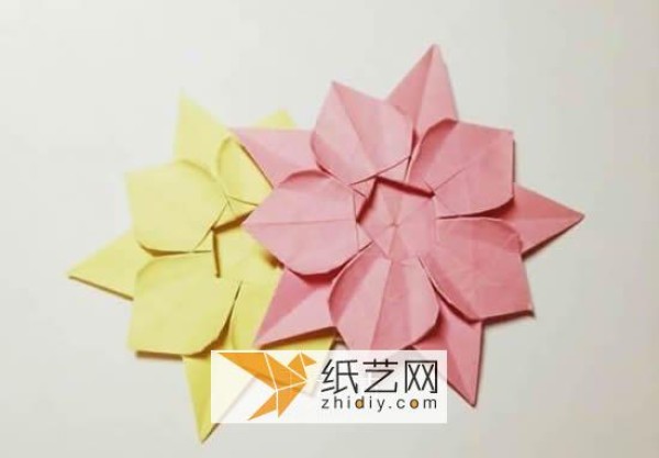 Tutorial on making origami Christmas flowers perfect for Christmas greeting cards