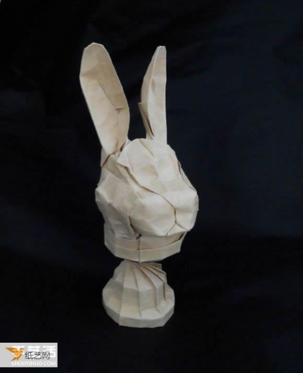 Detailed step-by-step illustration of using origami to fold a complex three-dimensional rabbit head