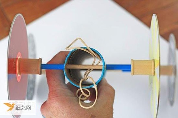 Simple and beautiful step-by-step illustration of the homemade rubber band powered car