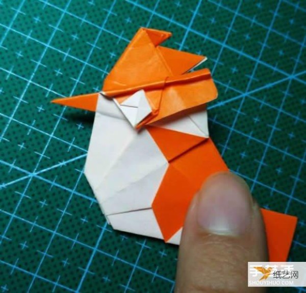 Detailed explanation of the manual method of folding a paper kingfisher tutorial.