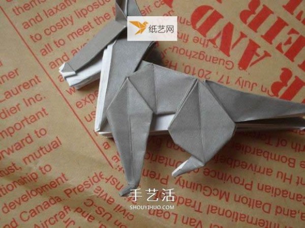 Illustration of hand folding cute puppy using origami