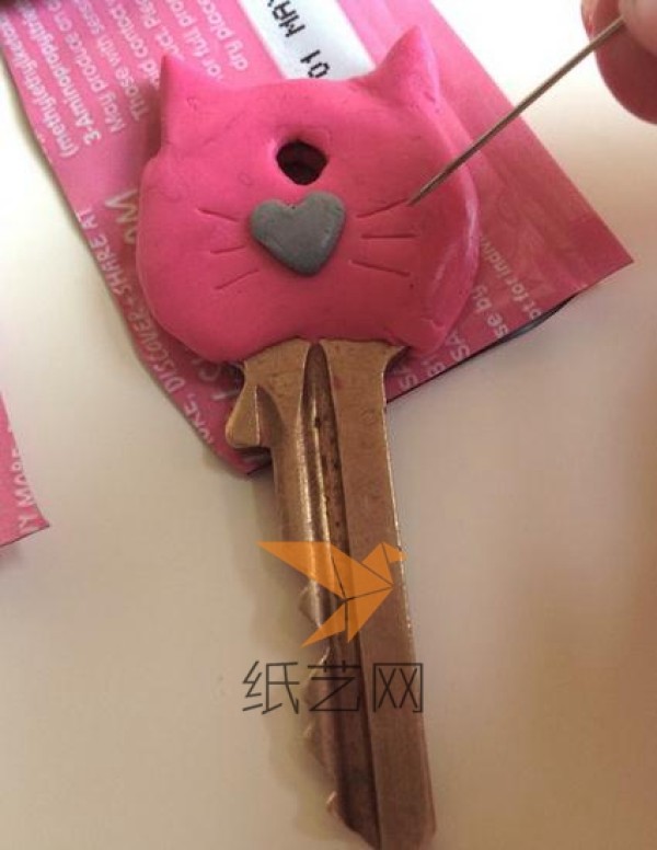 Kitten shaped key decoration made from clay