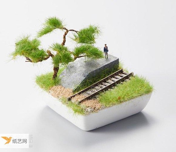 The train successfully drove into Bonsai Bonzai style railway model made by Japans Bonrama