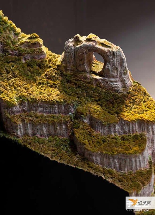 Transform the geography textbook directly into a super realistic book sculpture