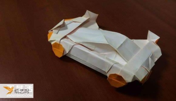 Illustrated tutorial that comprehensively demonstrates the method of hand-folding a paper sports car