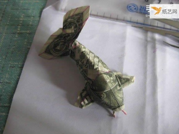 How to fold paper carp using dollars