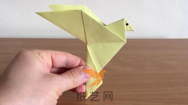 A step-by-step tutorial on how to make an origami peace dove