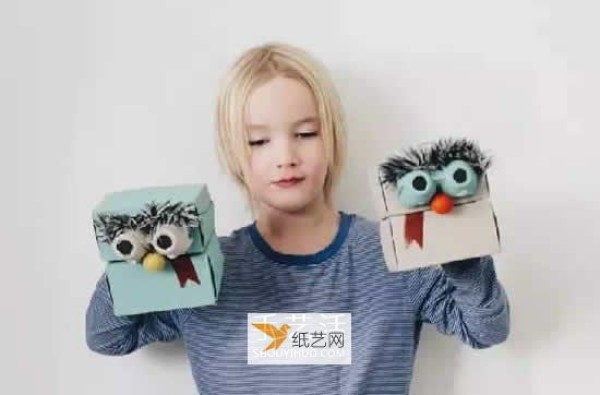 Describe how to use waste paper boxes to make hand puppets