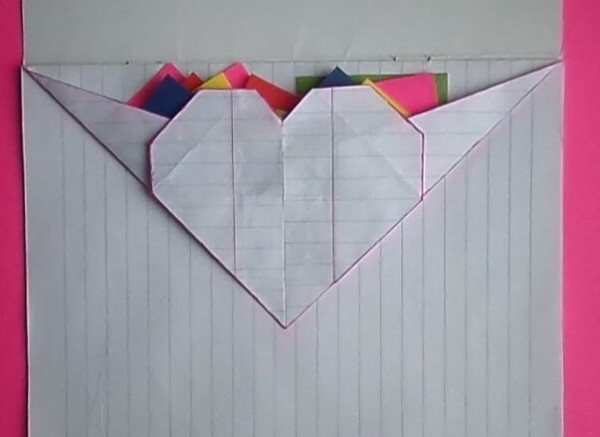 Handmade tutorial on folding creative origami hearts to store small pockets using a notepad