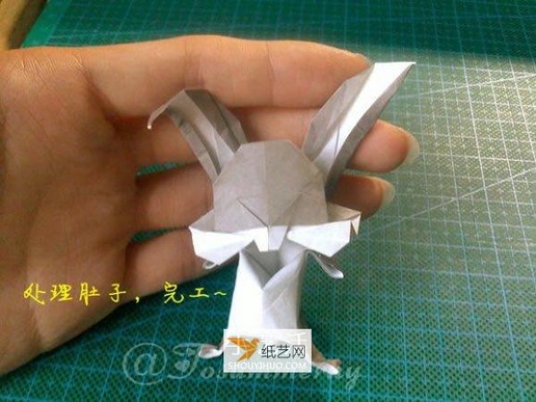 Illustration of how to prepare origami to fold Bugs Bunny