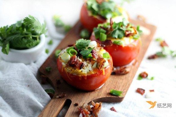 A new way to eat breakfast by beating eggs into tomatoes and then baking them in the oven