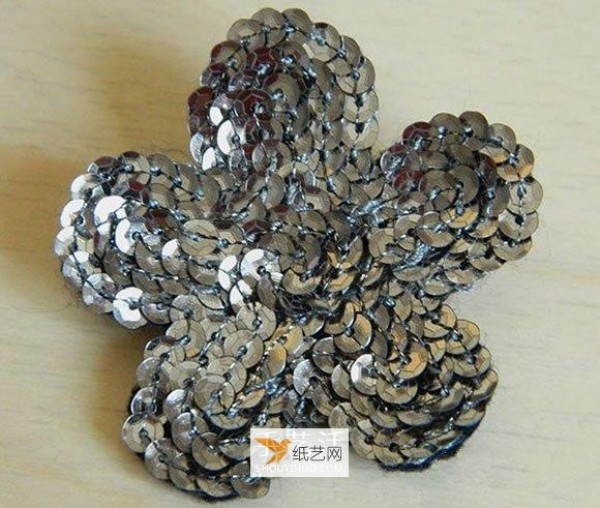 Use shiny fabric flowers to create beautiful brooches and clothing decorations