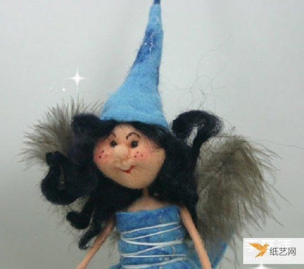 A particularly beautiful cartoon-style picture of a handmade wool felt girl doll