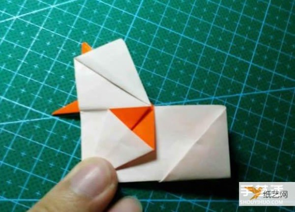 Detailed explanation of the manual method of folding a paper kingfisher tutorial.