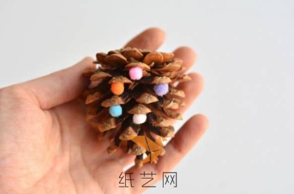 Girly Christmas tree decorations made by turning waste into treasures from pine cones