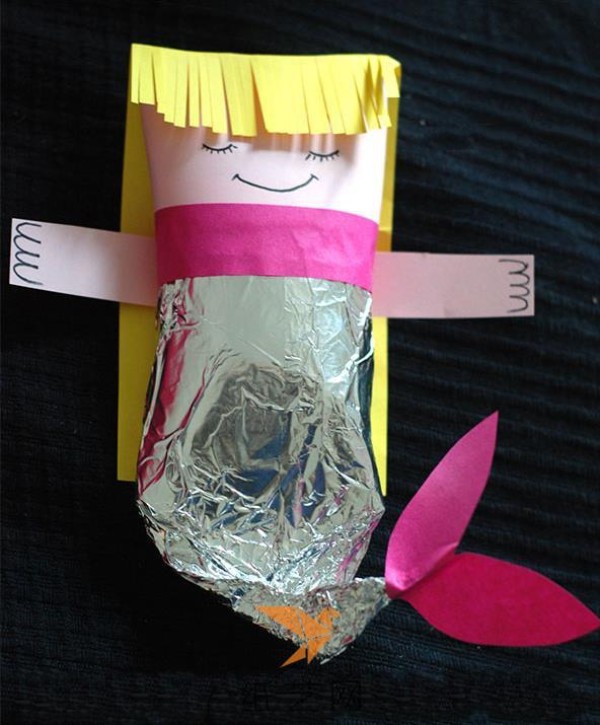 Child’s handmade innocent mermaid made from waste