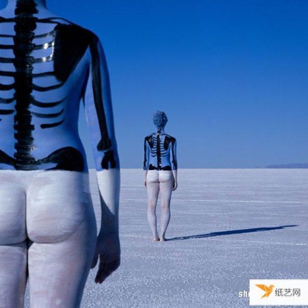 A surreal body painting photography that seems to blend into the heaven and earth