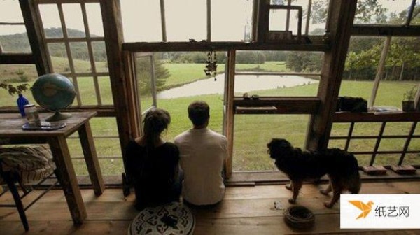 A dreamy lake house made of various old windows