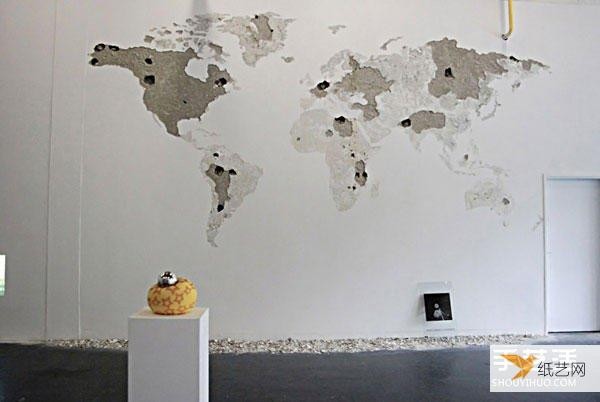 Make a personalized world map by tapping on the blank wall