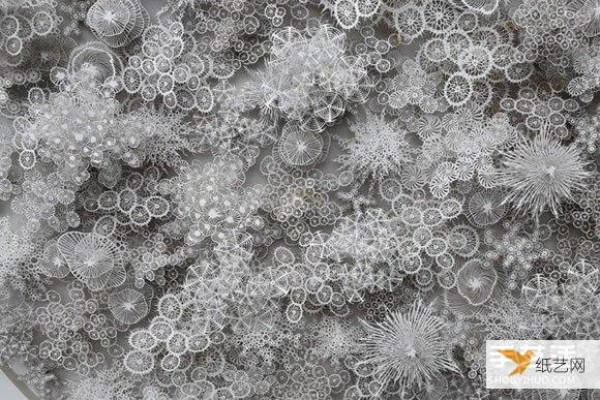 Three-dimensional paper sculptures created using bacterial crystals as inspiration