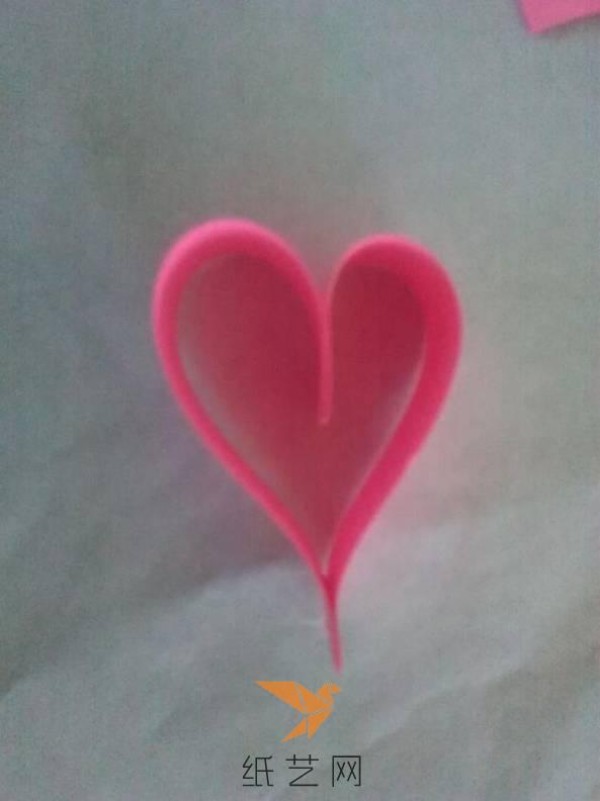 Tutorial on how to make a paper-quilled heart with wings for Valentine’s Day