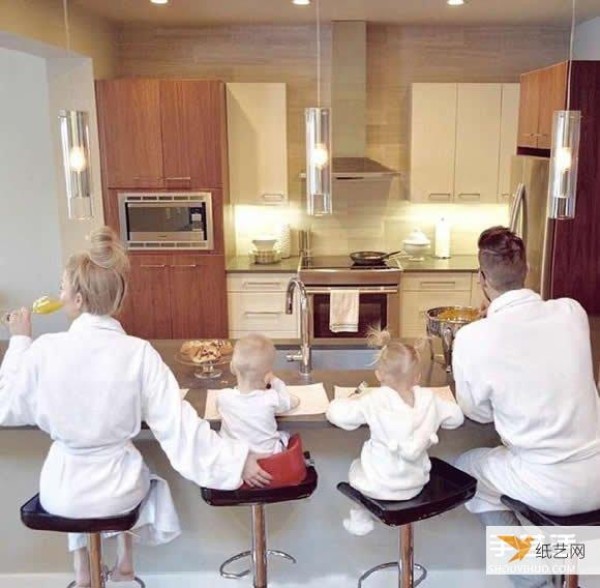 A creative family photo taken by a family of four wearing parent-child clothes