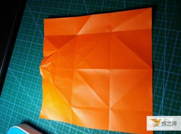 Detailed explanation of the manual method of folding a paper kingfisher tutorial.