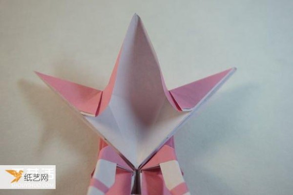 Illustrated step-by-step tutorial for girls using origami to fold something that looks complicated