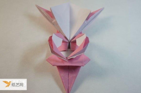 Illustrated step-by-step tutorial for girls using origami to fold something that looks complicated