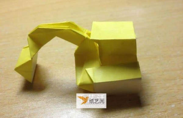 Illustration of the manual folding method of a small origami excavator