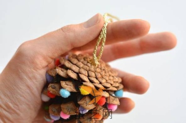 Girly Christmas tree decorations made by turning waste into treasures from pine cones