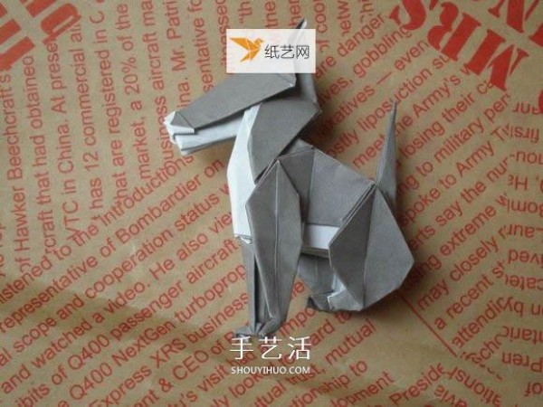 Illustration of hand folding cute puppy using origami