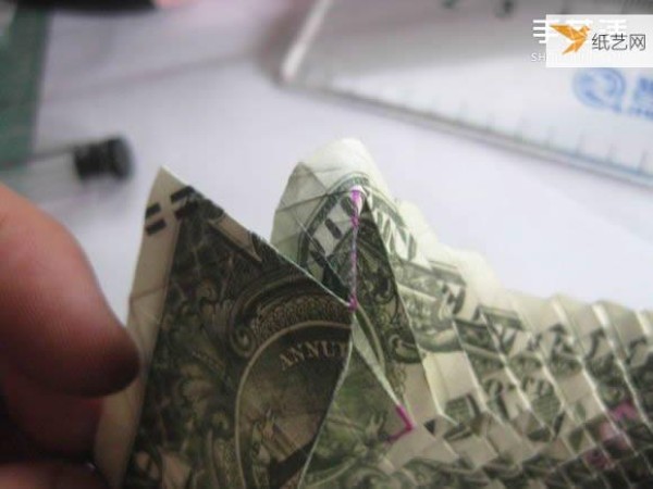 How to fold paper carp using dollars