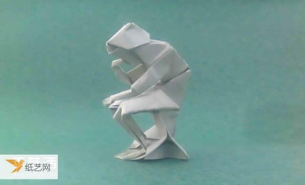 Detailed illustration of a sculpture of a pensive thinker using origami