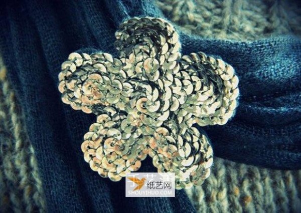 Use shiny fabric flowers to create beautiful brooches and clothing decorations