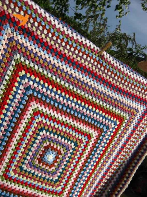 Detailed knitting tutorial for crocheting an oversized rainbow blanket