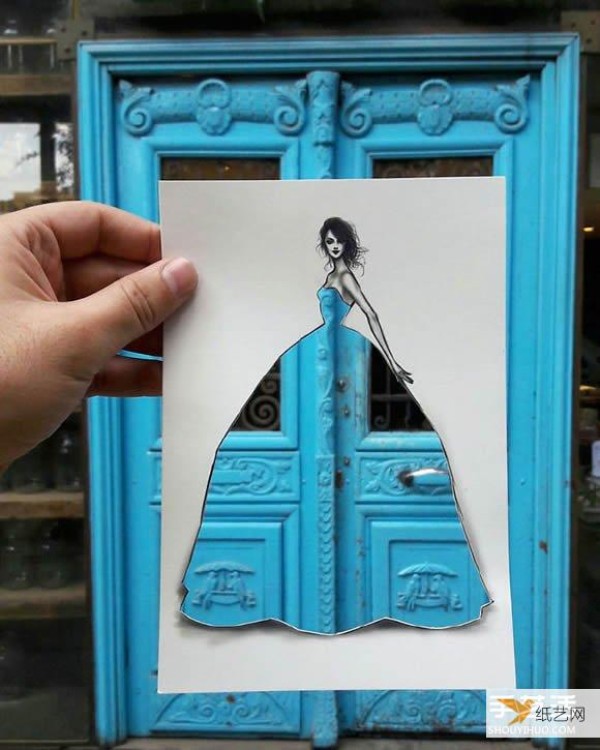 A very unique and creative paper-cut painting that puts the world into a dress!