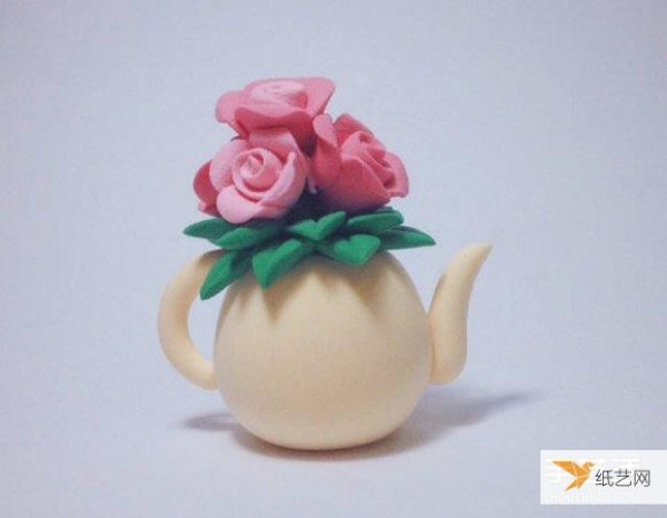 A kettle vase made of ultra-light clay and decorated with roses