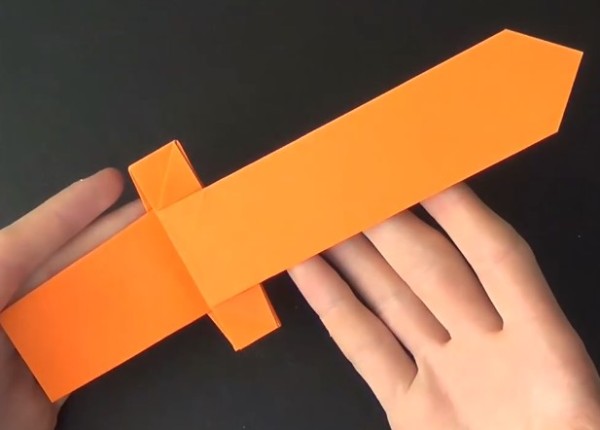 Tutorial on how to fold a simple origami toy or an origami sword for Childrens Day