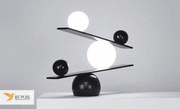 A clever balance between black and white. Balance table lamp designed by the Light Magician