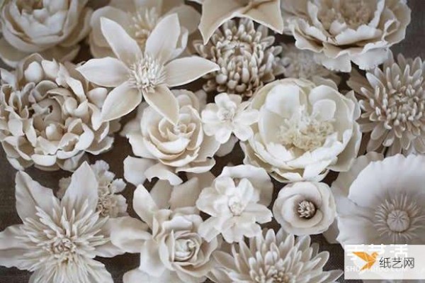 An elegant and simple porcelain flower sculpture that showcases the colorful world of flowers.