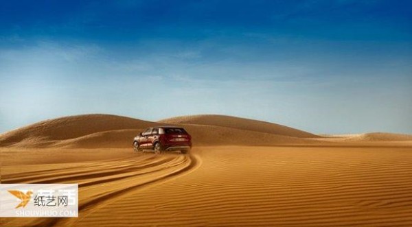 Create a 1:43 car world, an Audi desert advertisement specially produced by a miniature photographer