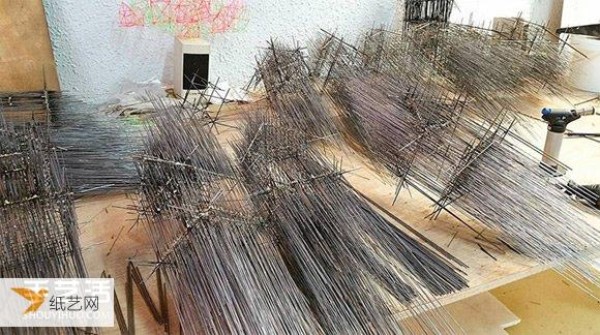 This is not a sketch. It is a sculpture woven from waste materials such as steel bars and piano strings.